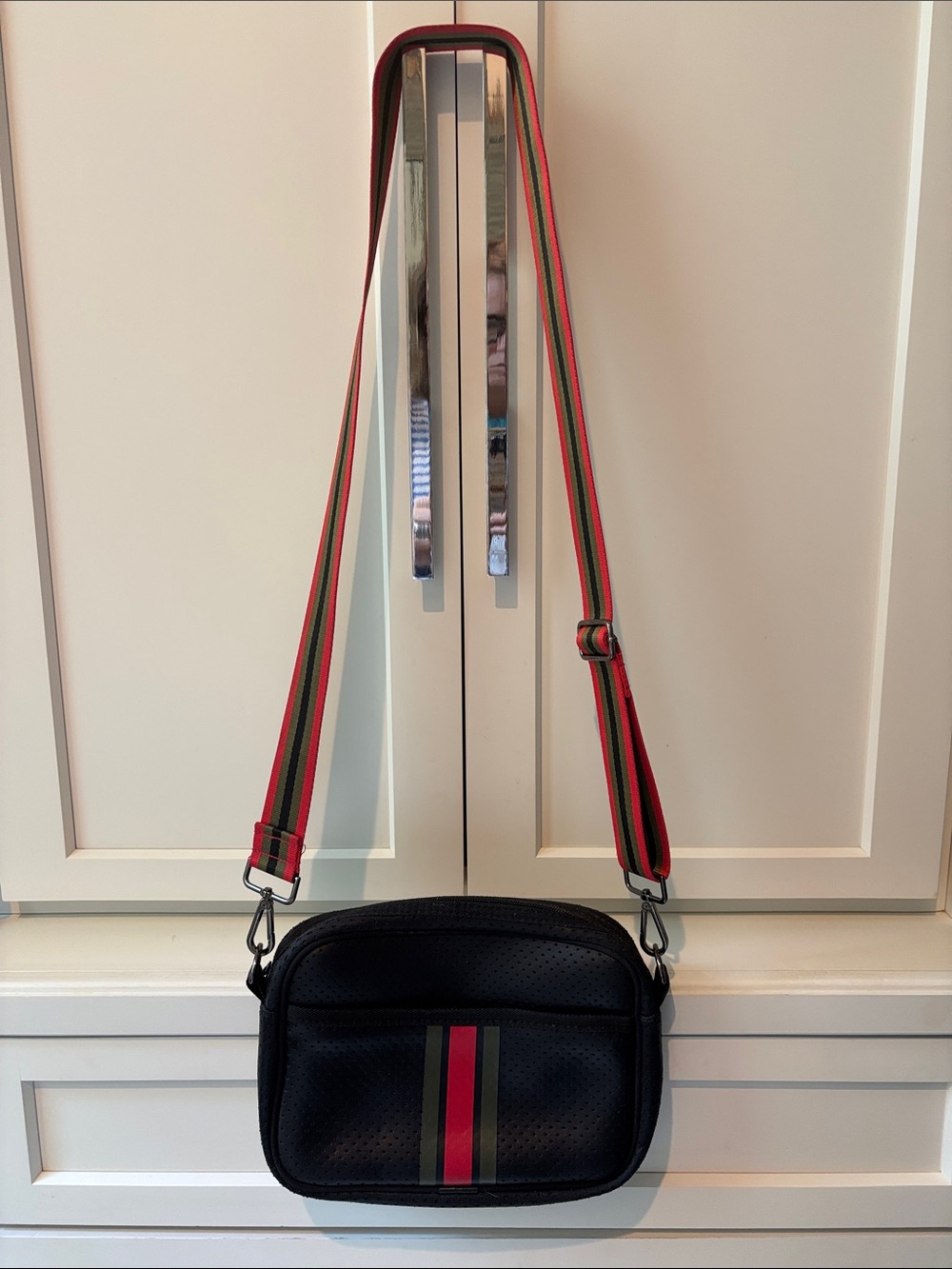 HAUTE SHORE Black Crossbody with Red and Green Stripe